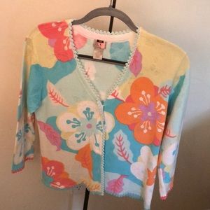 Adorable summer sweater with crystal buttons.